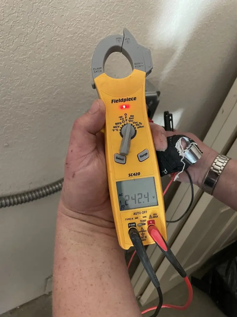 Voltage testing with clamp meter during Electrical Installation Services in Coconut Creek